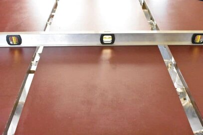 Level with bubble in the middle on top of table.